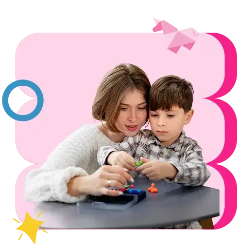 a woman playing toy with a young boy