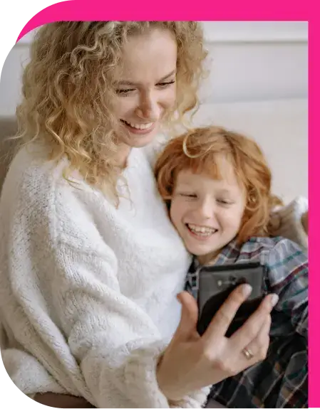 woman and a kid looking at a phone