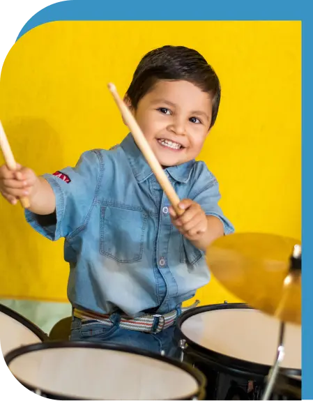 a young boy playing drums