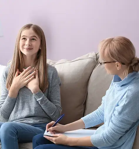 female psychologist working with teenage girl