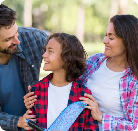 father and mother with their son holding a toy airplane