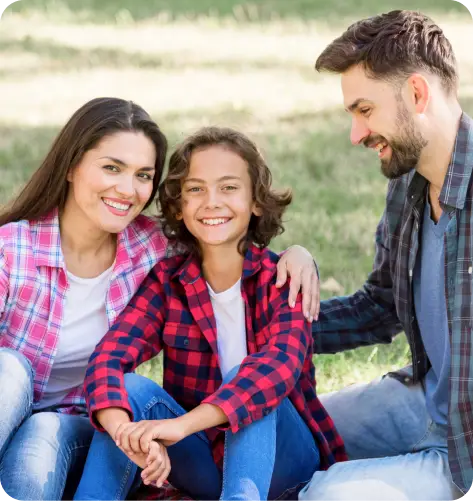 parents with their son in a playground